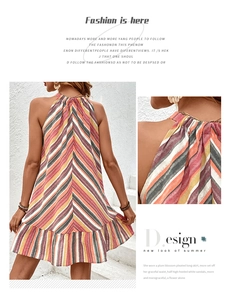 Detail of colorful striped halter neck dress with ruffled hem and lightweight fabric