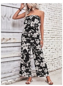 Detail of floral print off-shoulder jumpsuit with elastic waist and wide leg cut