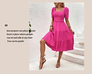 Detail of rose red tiered summer dress with puff sleeves and smocked square neckline