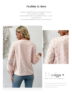 Detail of light pink blouse featuring gold foil polka dots and hollow lace patchwork sleeves