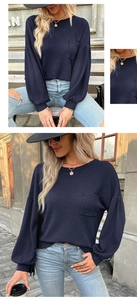 Detailed waffle knit texture and pocket on this navy blue long sleeve top for women