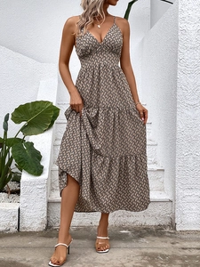 Bohemian V-neck backless tiered maxi dress with abstract print and spaghetti straps