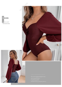Detail of burgundy V-neck bodysuit with twist front design and stylish puff long sleeves
