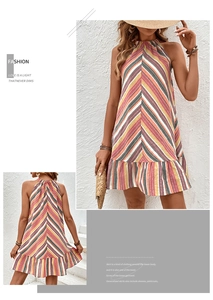 Detail view of a halter neck striped summer dress with ruffled hem and colorful pattern