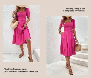 Detail view of the smocked square neck and bubble sleeves on a rose red tiered midi dress