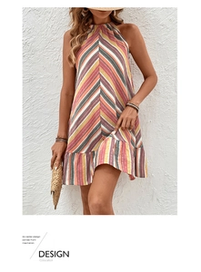 Detail of colorful striped halter dress with ruffled hem and vacation-style accessories