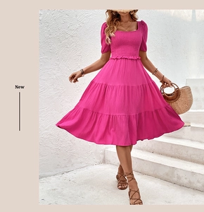 Detail of smocked waist and tiered skirt on a fuchsia square neck midi dress