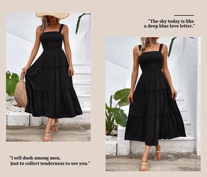 Détail d'une robe longue noire à volants avec bustier élastique et fines bretelles