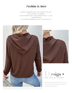 Detail of raglan sleeves and elastic cuffs on a brown drawstring hoodie
