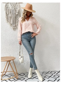 Detail of pink long sleeve shirt with gold foil polka dots and white lace trimmings