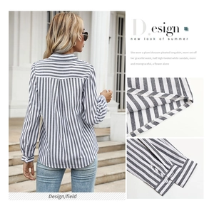 Detail view of striped long-sleeve shirt showing curved hem and button cuffs on back