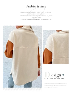 Detail of two-tone fleece jacket featuring cream body and brick red contrasting sleeves