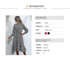 Detailed view of striped long sleeve dress with high neck and pleated hemline