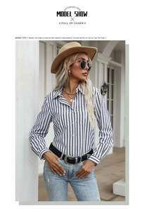 Detailed view of striped long-sleeve shirt with lapel collar and front chest pockets