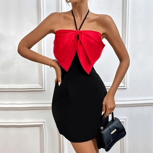 Elegant halter neck mini dress with a large red bow and contrast black slimming fit