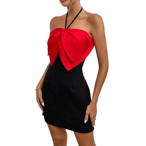 Elegant halter neck bodycon dress featuring oversized red bow contrast and black short skirt