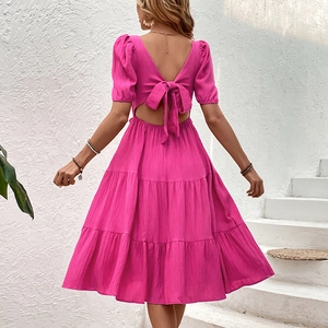 Pink backless midi dress with puff sleeves, V-neck back and tiered ruffle cake skirt