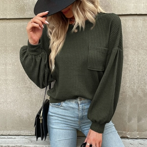 Casual dark green waffle knit long sleeve top with crewneck and decorative chest pocket