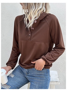 Detailed view of dark brown hoodie with button neck placket and elastic cuffs for women