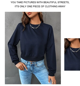 Detail showing navy blue raglan sleeve sweatshirt with ribbed cuffs and crew neck