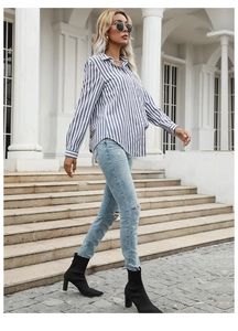 Close-up of blue striped button-up shirt with lapel collar and long sleeves for women