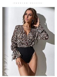 Detail view of leopard print bodysuit showing deep V-neck and stylish tied cuffs decoration