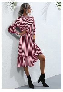 Detailed view of red and white striped dress with ruffled collar and flared hem