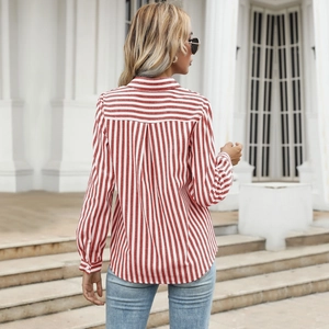 Back view of a red and white striped long sleeve button shirt with a collar and back pleat