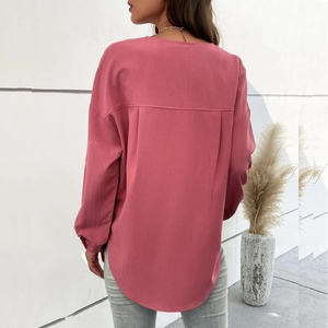 Dusty rose long sleeve blouse with textured fabric and elegant back pleated detail