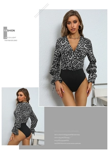 Detail view of leopard print long sleeve bodysuit with deep V-neck and slim fit design