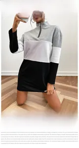 Detail of color-block sweatshirt dress with half-zip stand collar in black grey white