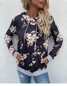 Detail of floral print hoodie with kangaroo pocket and grey ribbed cuffs and hem