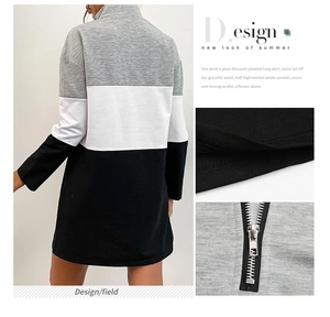 Detail of color block hoodie dress with high collar and back zipper in black and grey