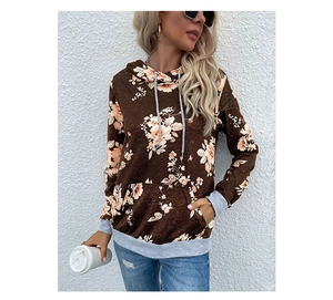 Detail of floral print hoodie with grey ribbed cuffs and contrast patchwork sleeves