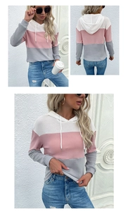 Macro detail of color-block hooded waffle knit top in white, pink, and grey textures