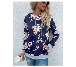 Detail of navy floral print hoodie featuring light grey cuffs and a kangaroo pocket