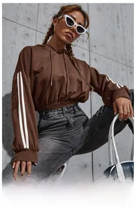 Close-up of coffee brown cropped hoodie with white double stripes on sleeves and drawstring