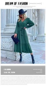 Detail of V-neck dark green long-sleeved dress with button decor and tiered skirt layers