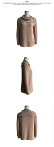 Detail showing asymmetric cowl neck knit top with wood buttons and vertical rib texture