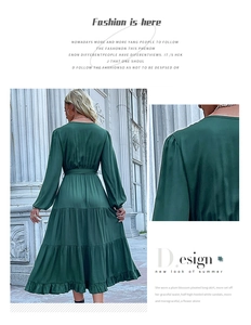 Detail of dark green tiered maxi dress featuring elastic cuffs and a waist tie belt