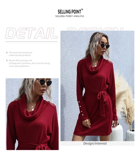 Detail of red cowl neck knit dress with ribbed texture and buttoned sleeve cuffs