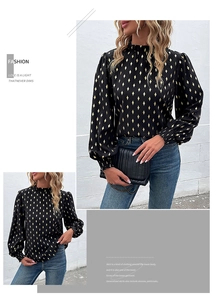 Detail of black long-sleeve blouse with gold diamond pattern and ruffled high neck