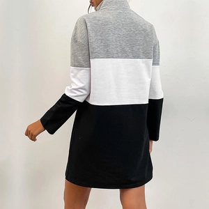 Back view of women's long-sleeve color-block sweatshirt dress in grey, white, and black