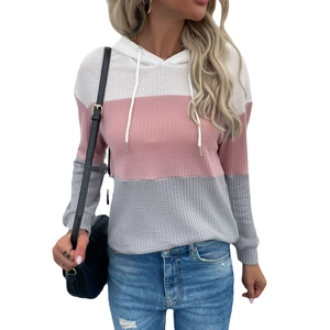 Women's waffle knit hoodie featuring pink, white, and grey color-block patchwork design