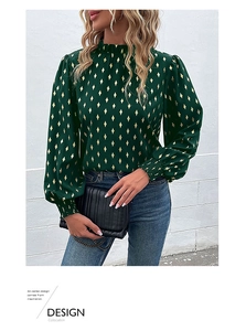 Detail of dark green blouse with gold foil diamond print and elegant ruffled high neck