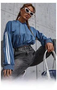 Detail of blue cropped hoodie featuring white stripes on sleeves and drawstring hood