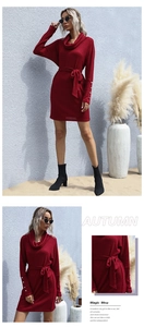 Detail view of burgundy knit dress with turtleneck, waist belt and gold buttons on cuffs