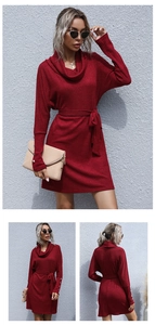 Detail of dark red knit dress with turtleneck, buttoned cuffs and waist belt tie