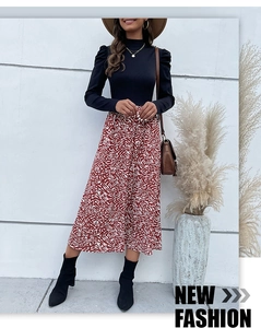 Detail of elegant black slim turtleneck top with vintage puff sleeves and A-line skirt