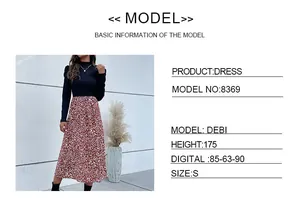 Size chart detail showing measurements for the navy puff sleeve dress with tiger print skirt
